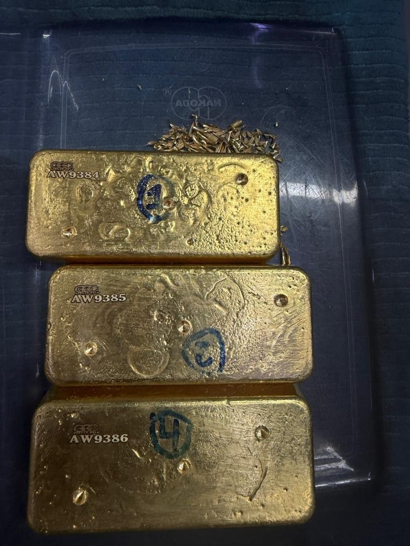 Three gold bars prepared for the documented transaction