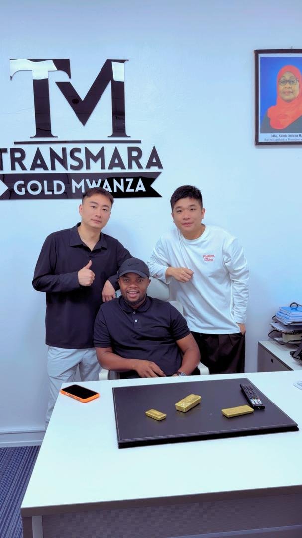 Client coordination at the Mwanza office with gold bars on the desk
