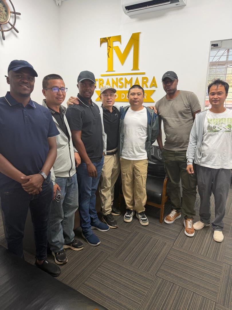 TransMara team and international partners at a branded office