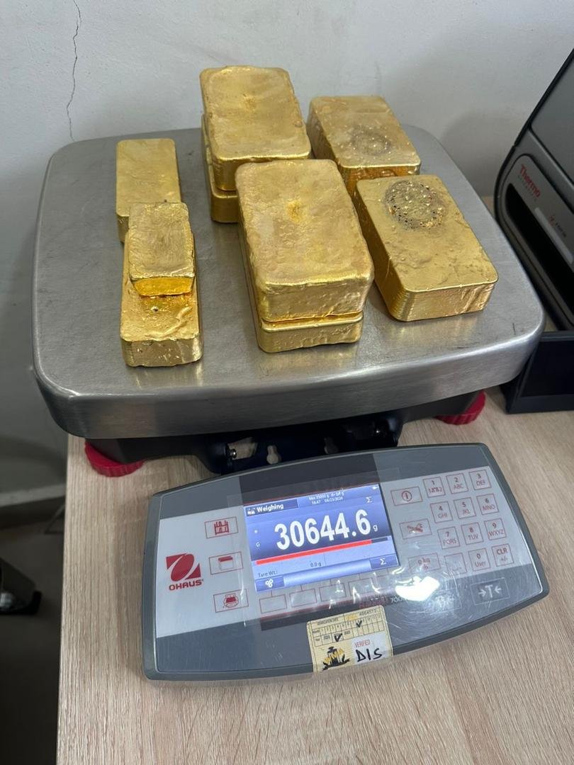 Weight verification of 30,644.6 grams on calibrated OHAUS scale